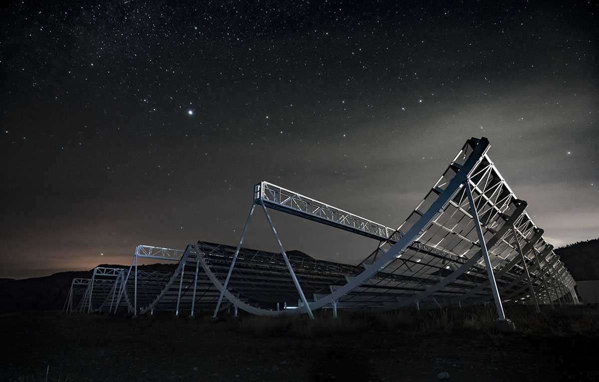The Canadian Hydrogen Intensity Mapping Experiment (CHIME) telescope at night.
